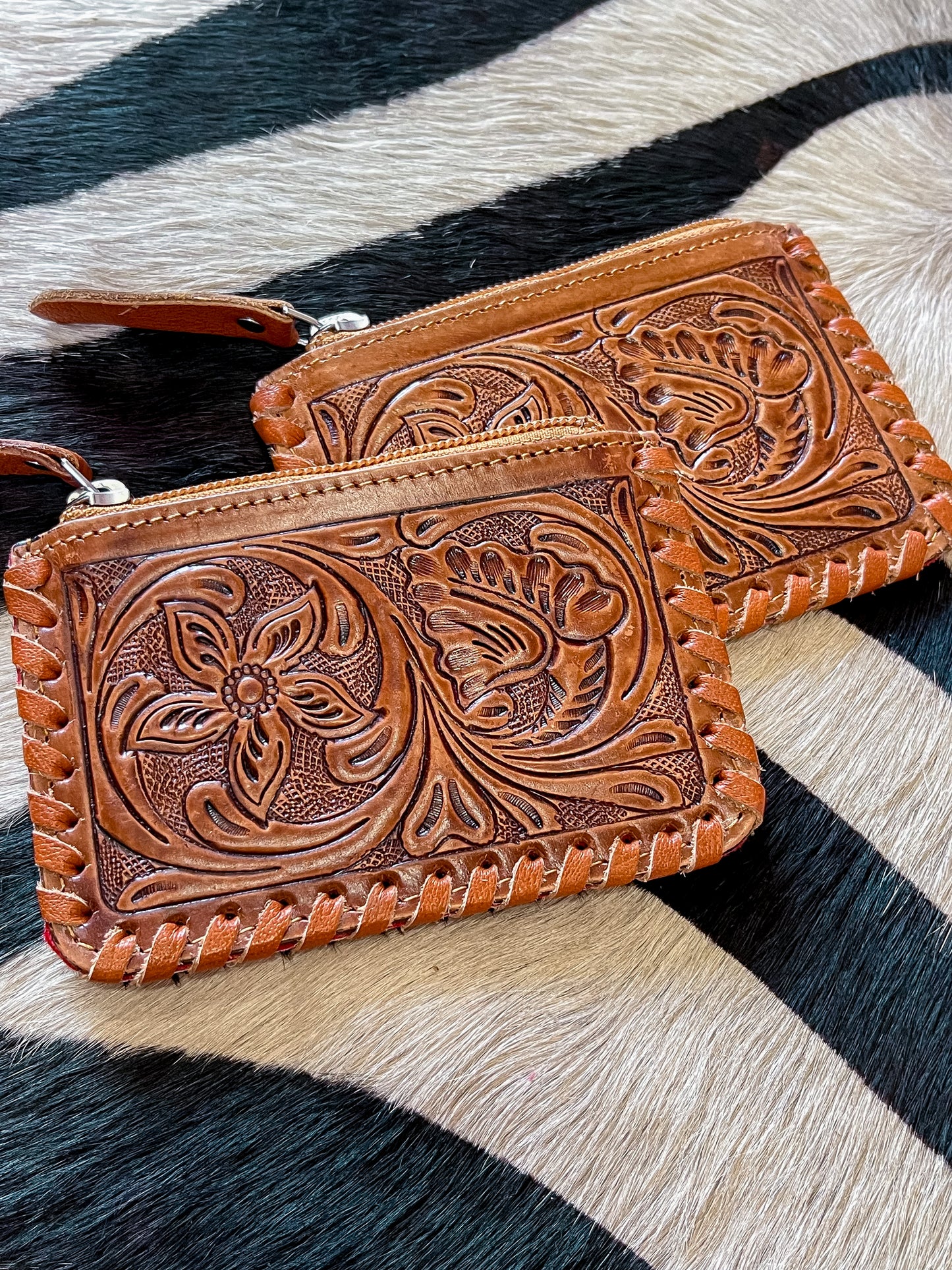 The Tooled Cowhide Zipper Wallets