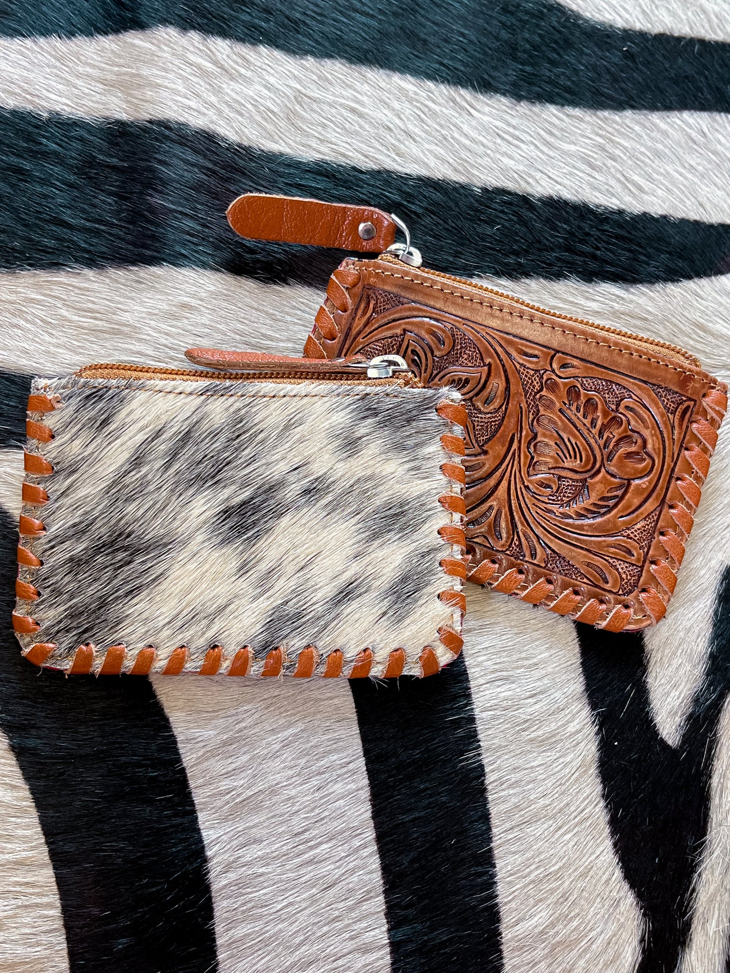 The Tooled Cowhide Zipper Wallets