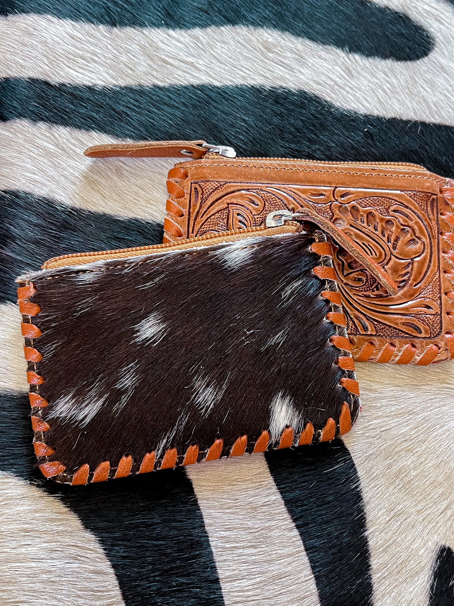 The Tooled Cowhide Zipper Wallets