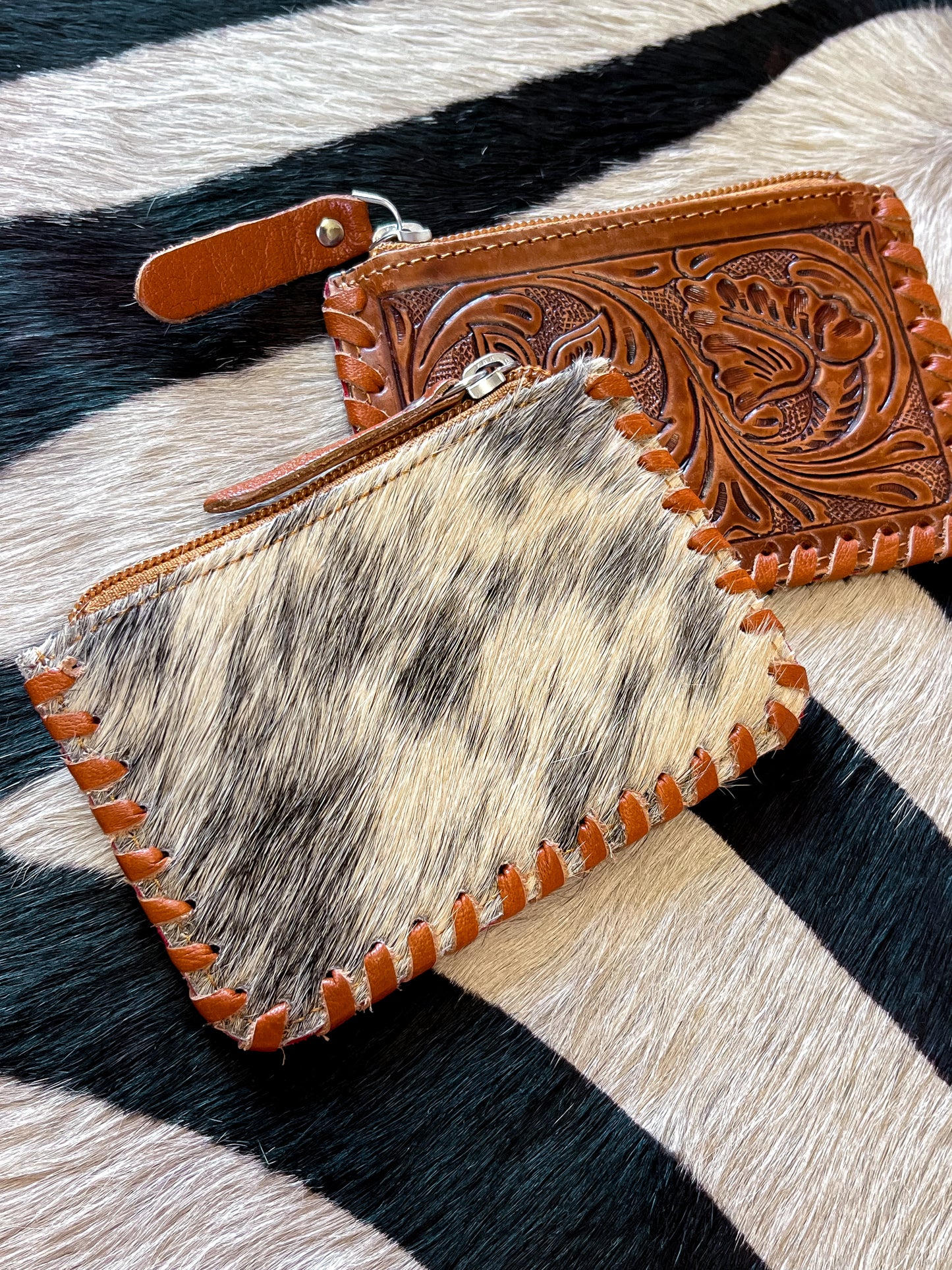 The Tooled Cowhide Zipper Wallets